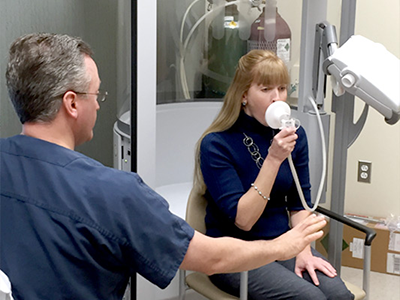Woman Doing a Pulmonary Test